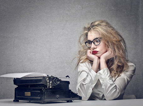 Writer stares at typewriter