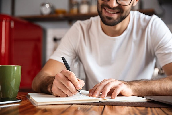 Man writing with pen